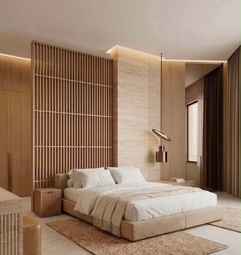 Alabaster residential bedroom interior design in Dubai with timber screening, travertine feature wall, neutral textiles and warm lighting