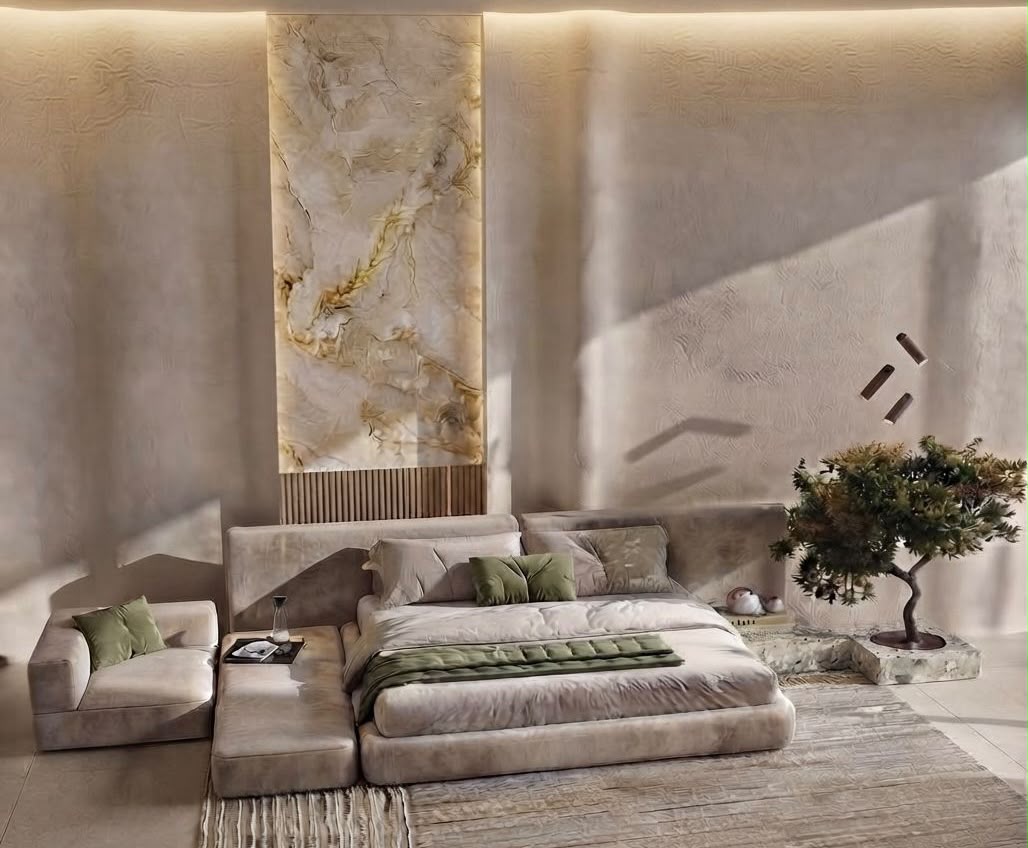 AVII residential feature bedroom in Dubai with dark sculptural wall treatment, warm amber tones, upholstered bed and integrated perimeter lighting