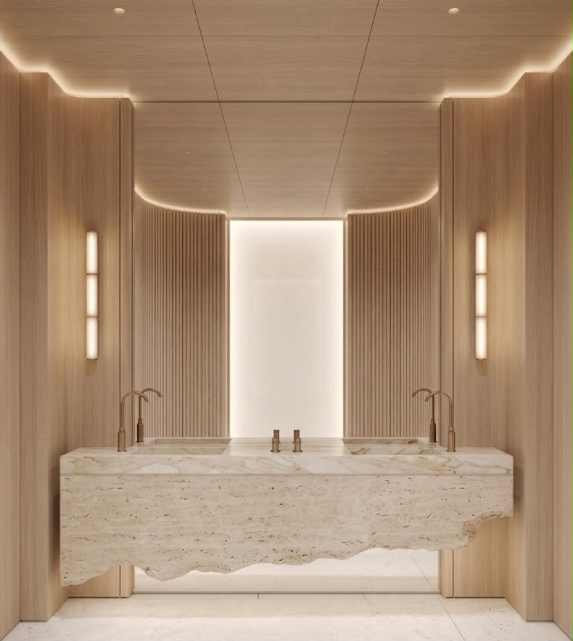 Solara double vanity bathroom design in Dubai with sculpted natural stone counter, timber walls and symmetrical integrated lighting